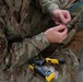 U.S. Air Force SrA Gavin Counts assists with running new wires and networks in a new Tribal Health IT building