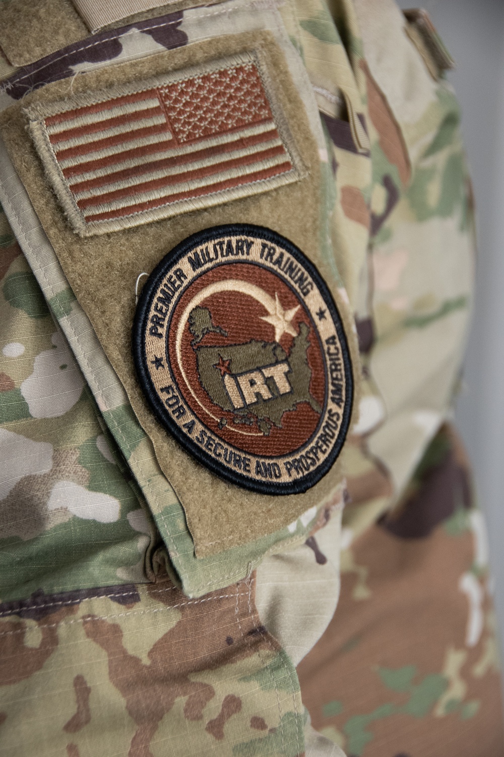 U.S. Air Force SrA Gavin Counts assists with running new wires and networks in a new Tribal Health IT building