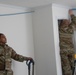 U.S. Air Force SrA Nathan Cotrill and Alexi Rickman assist with a rewiring project at a new Blackfeet Tribal Health IT building