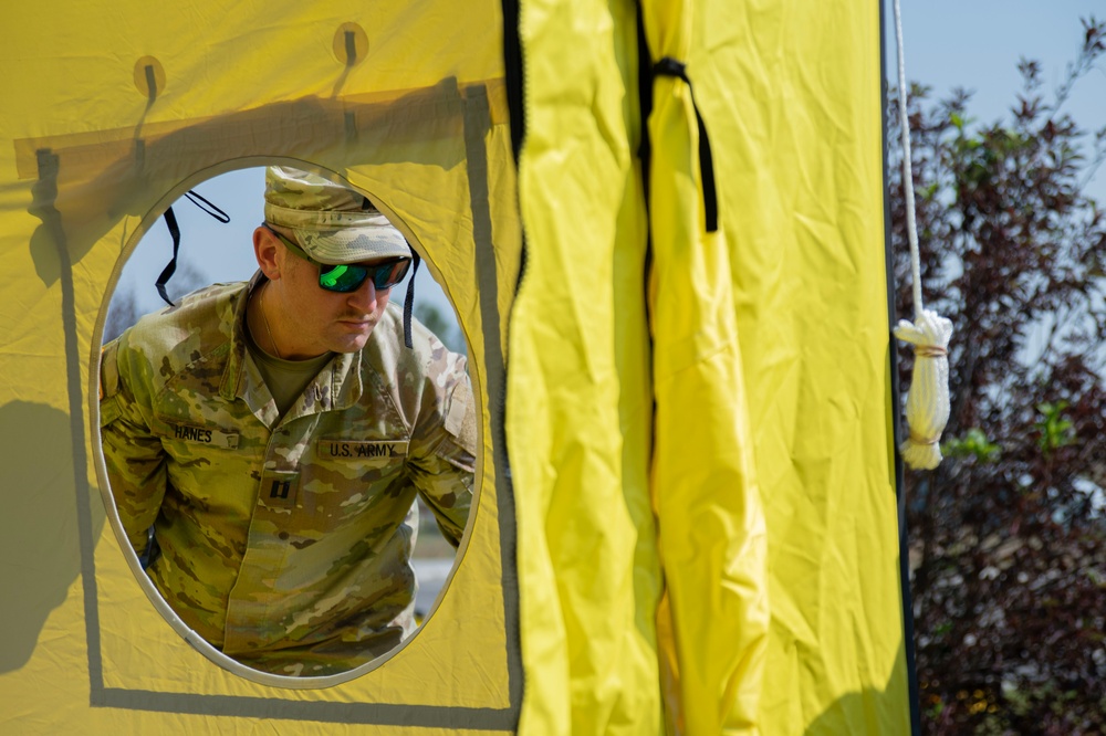 U.S. Army Cast. James Hanes sets up a decontamination tent for a training activity