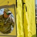 U.S. Army Cast. James Hanes sets up a decontamination tent for a training activity