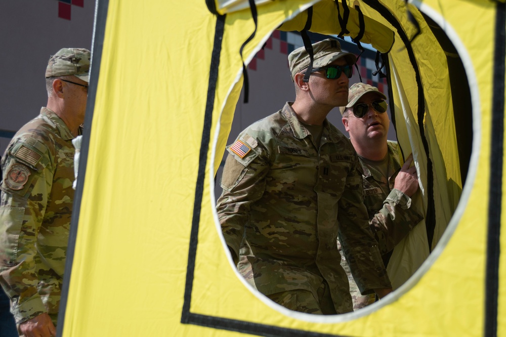 U.S. Air Force Maj. Stephen Kesterson and Capt. James Hanes set up a decontamination tent on Blackfeet Indian Reservation