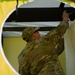 U.S. Air Force Maj. Stephen Kesterson and Capt. James Hanes set up a decontamination tent on Blackfeet Indian Reservation