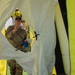 U.S. Air Force Maj. Stephen Kesterson and Capt. James Hanes set up a decontamination tent on Blackfeet Indian Reservation