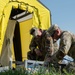 U.S. Air Force Maj. Stephen Kesterson and Capt. James Hanes set up a decontamination tent on Blackfeet Indian Reservation