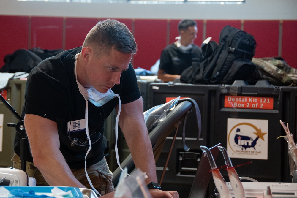 U.S. Air Force Capt. Dontas Sandargus joins service members from all around the world to provide a no-cost medical clinic