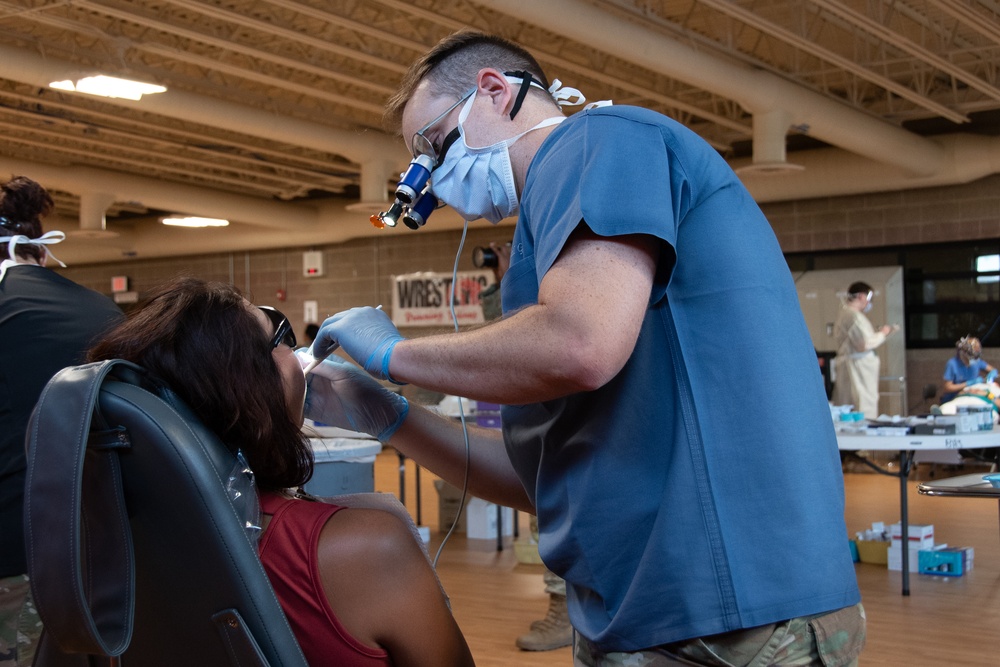 U.S. Air Force Capt. Bill Rysenga provides dental care to a patient during the Blackfeet Tribal Health - Operation Walking Shield