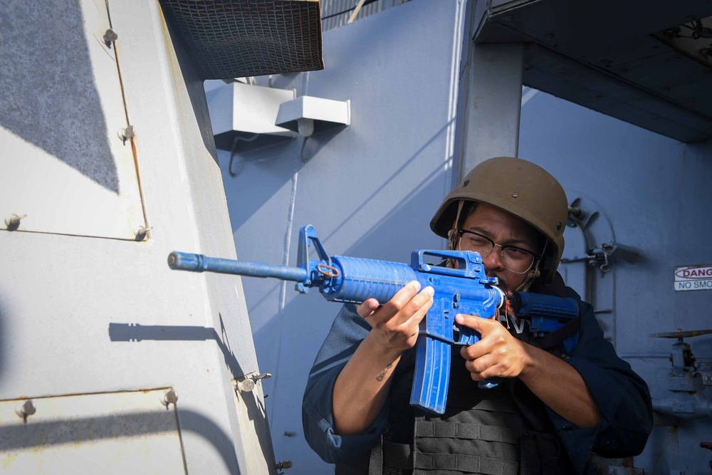 Sailor Aboard Arleigh Burke-Class Guided-Missile Destroyer USS Kidd (DDG 100) Participates in a  Anti-Terrorism Drill During RIMPAC 2024.