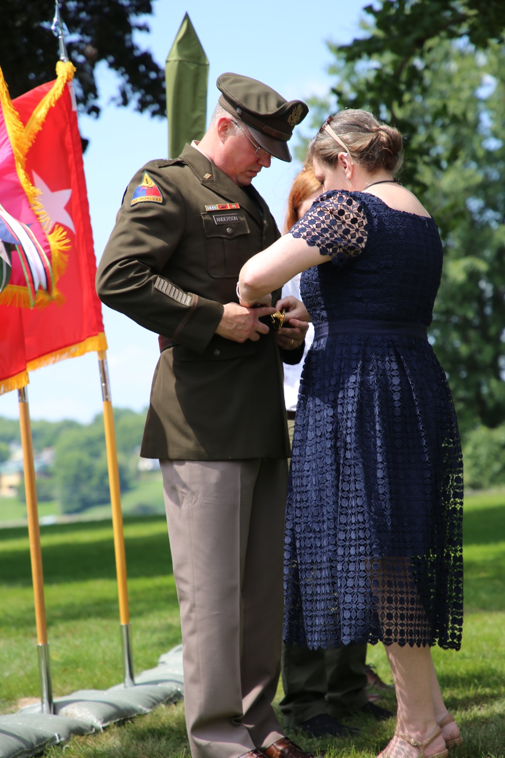 Ms. Laura Anderson Presents BG Anderson with his General Officer's Belt