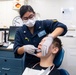USS Theodore Roosevelt Hospital Corpsman Conducts Dental Care for Sailors