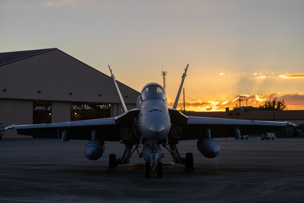 U.S. Marines with VMFA(AW) 224 maintain F/A-18 Hornet Aircraft after flight operations at Suwon AB