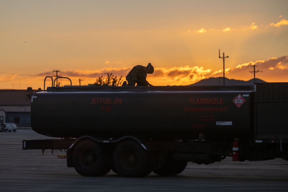 U.S. Marines with VMFA(AW) 224 maintain F/A-18 Hornet Aircraft after flight operations at Suwon AB