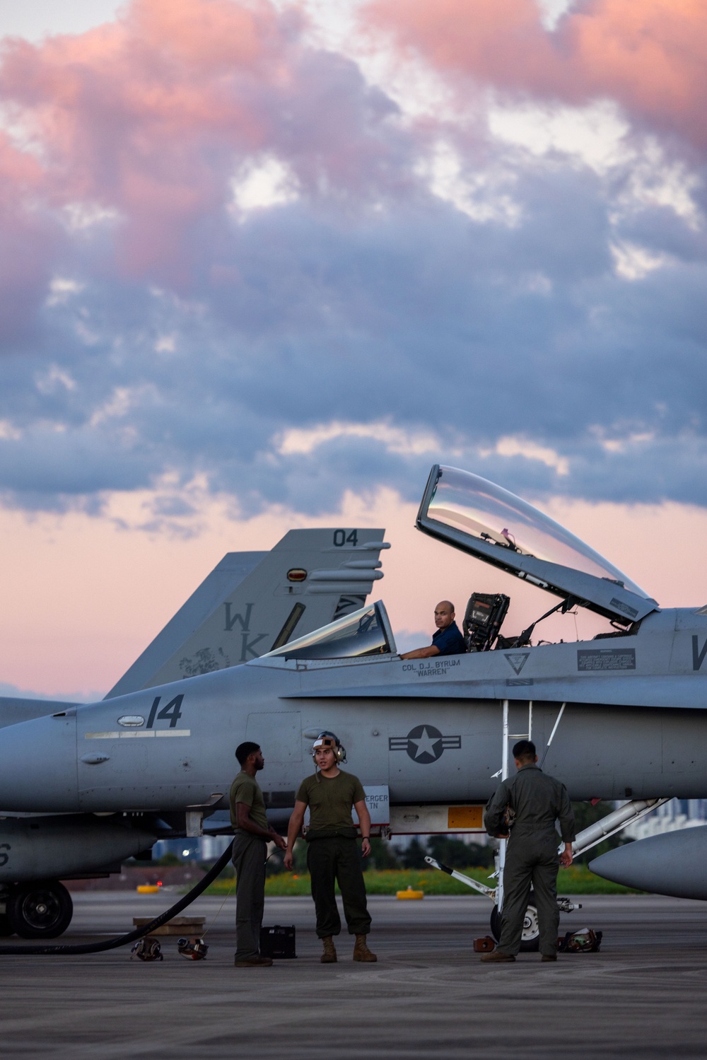 U.S. Marines with VMFA(AW) 224 maintain F/A-18 Hornet Aircraft after flight operations at Suwon AB