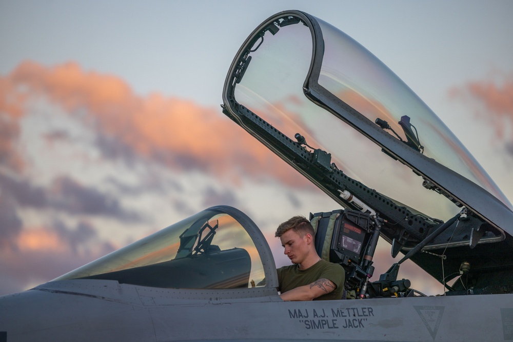 U.S. Marines with VMFA(AW) 224 maintain F/A-18 Hornet Aircraft after flight operations at Suwon AB