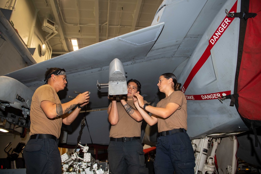 Sailors Aboard USS Carl Vinson (CVN 70) Conduct Maintenance on an F/A-18E Super Hornet