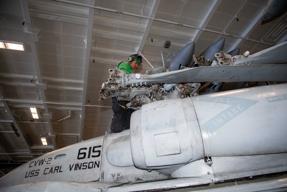 Sailor Aboard USS Carl Vinson (CVN 70) Conduct Maintenance on an F/A-18E Super Hornet