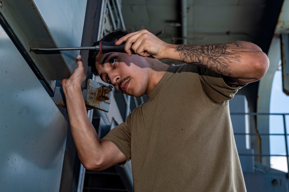 Sailor Aboard USS Carl Vinson (CVN 70) Performs Maintenance on a Test Cell