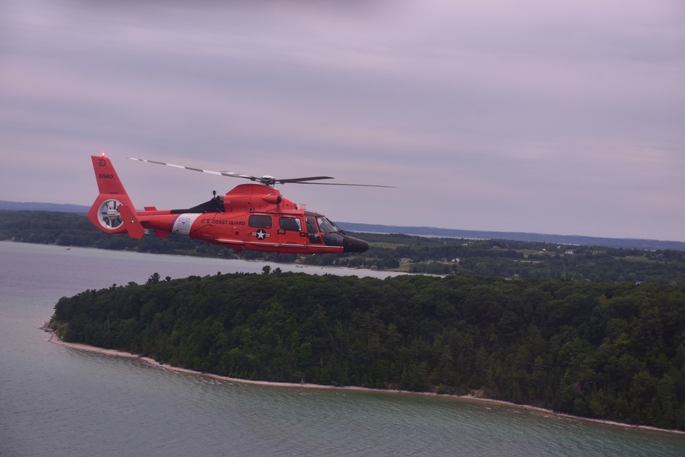 Coast Guard Air Station Detroit flys formation with Air Station Traverse City