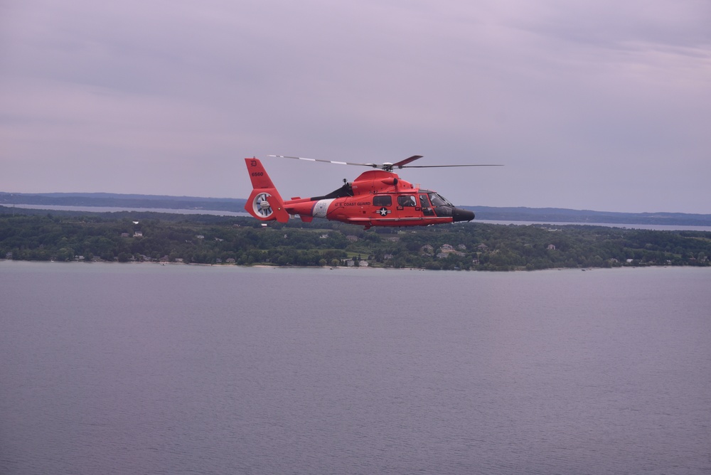 Coast Guard Air Station Detroit flys formation with Air Station Traverse City