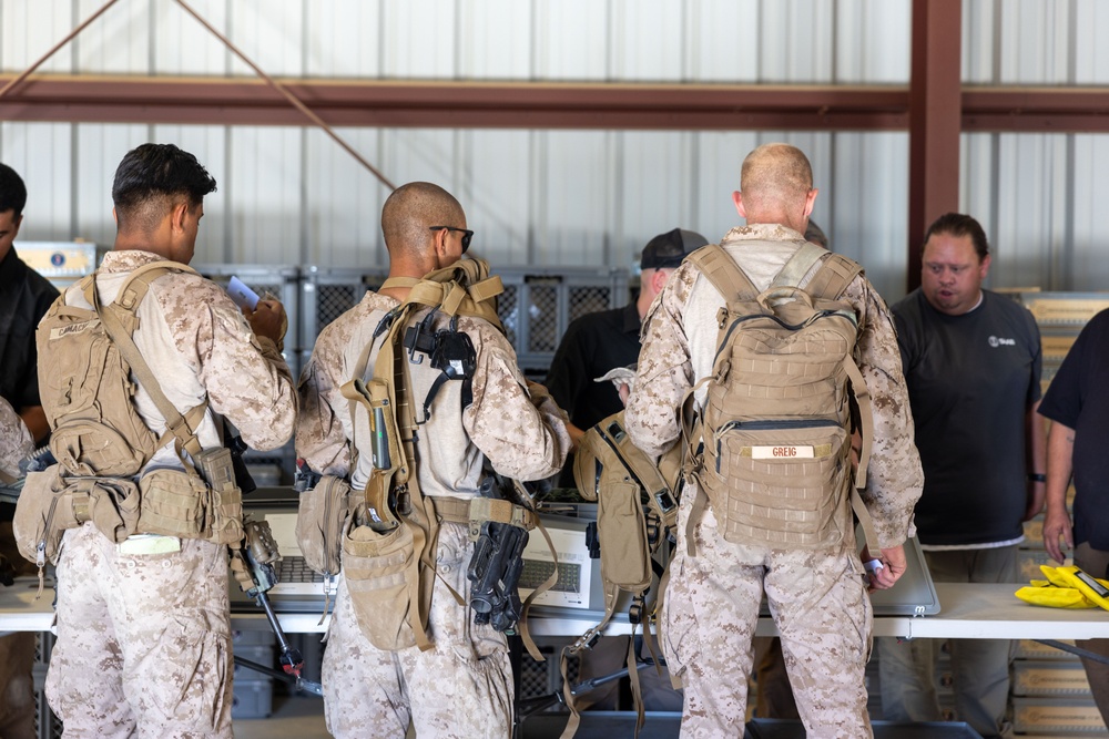 Marines are issued Marine Corps Tactical Instrumentation System gear during SLTE 5-24