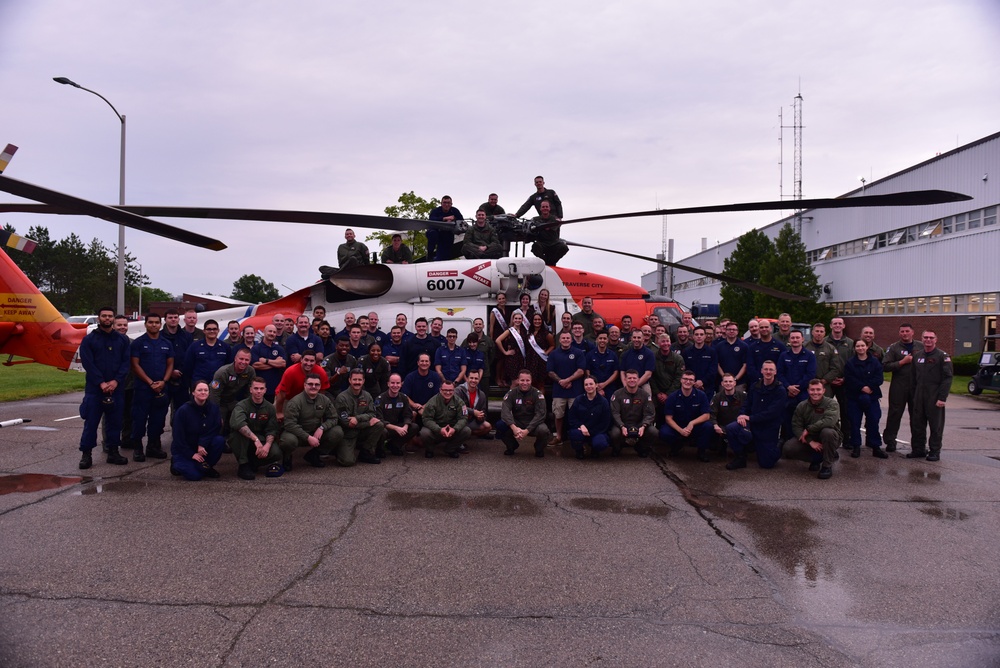 Coast Guard crews pose with Cherry Festival court