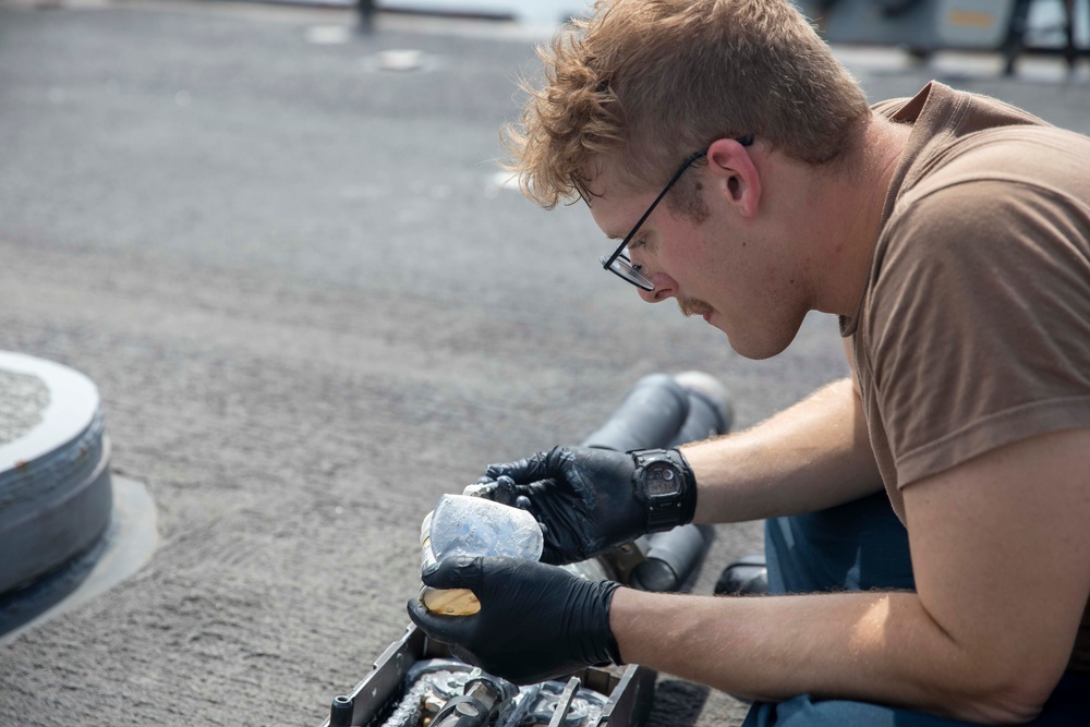 Sailor Conducts Maintenance