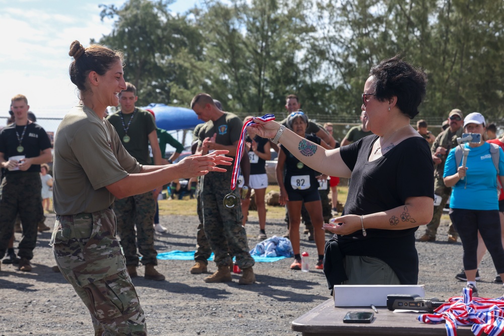 Fast and Fearless: Service members and their families participate in the 2024 Bellows 12k Rucksack Race