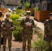 Airmen from the 377th Air Base Wing gather inspect common areas at a local apartment complex