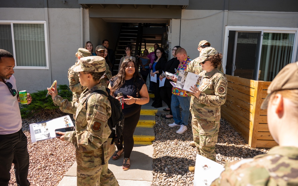 Members of the 377th Air Base Wing engage with apartment managers during a tour of rental properties