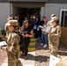 Members of the 377th Air Base Wing engage with apartment managers during a tour of rental properties