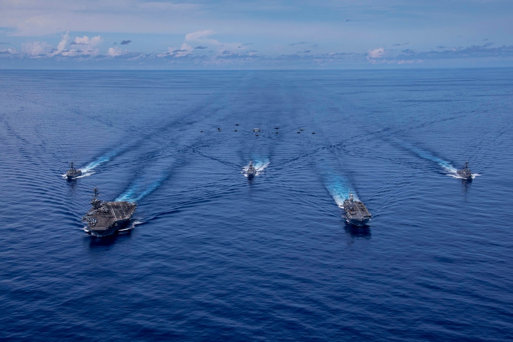 Abraham Lincoln Carrier Strike Group and Cavour Strike Group Sail in the Pacific Ocean