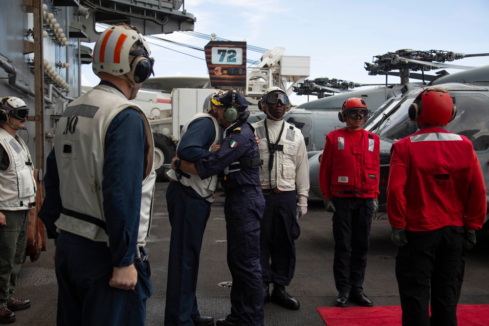 Rear Adm. Giancarlo Ciappina arrives aboard USS Abraham Lincoln