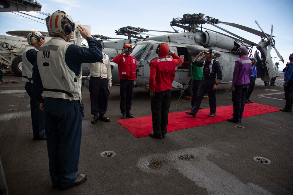 Rear Adm. Giancarlo Ciappina arrives aboard USS Abraham Lincoln