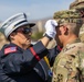 Mother pins new rank on son in emotional promotion ceremony