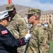 Mother pins new rank on son in emotional promotion ceremony