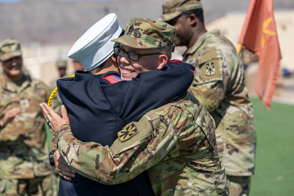 Mother pins new rank on son in emotional promotion ceremony