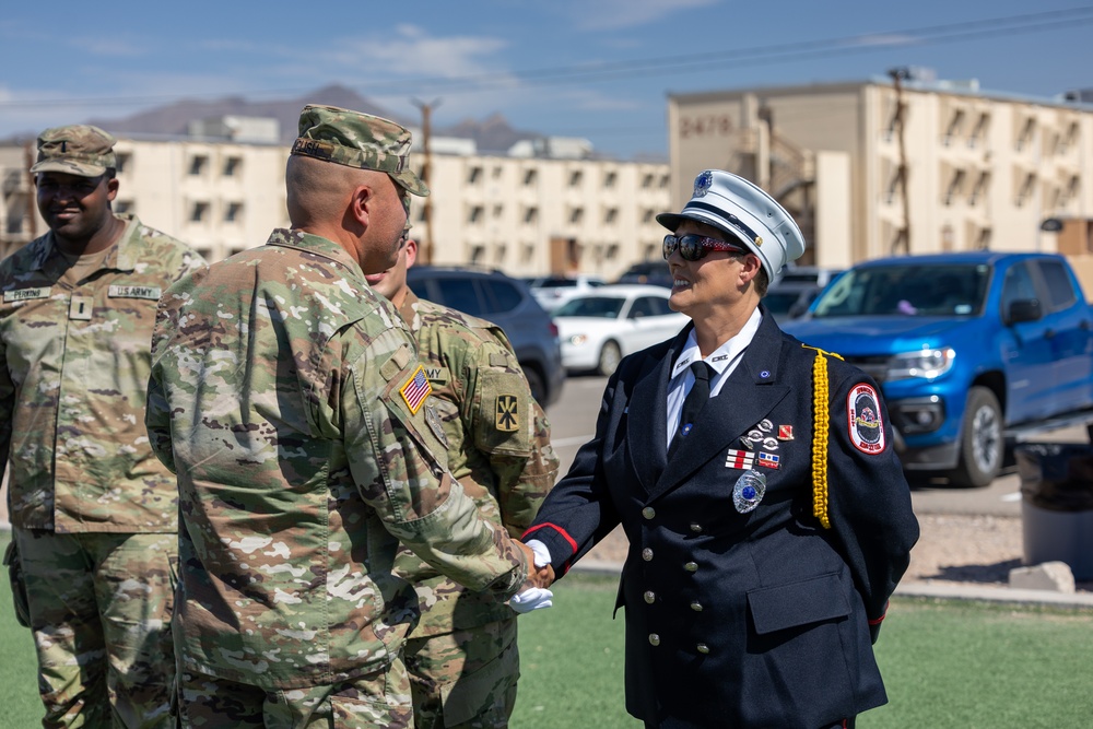 Mother pins new rank on son in emotional promotion ceremony