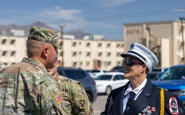 Mother pins new rank on son in emotional promotion ceremony