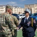 Mother pins new rank on son in emotional promotion ceremony