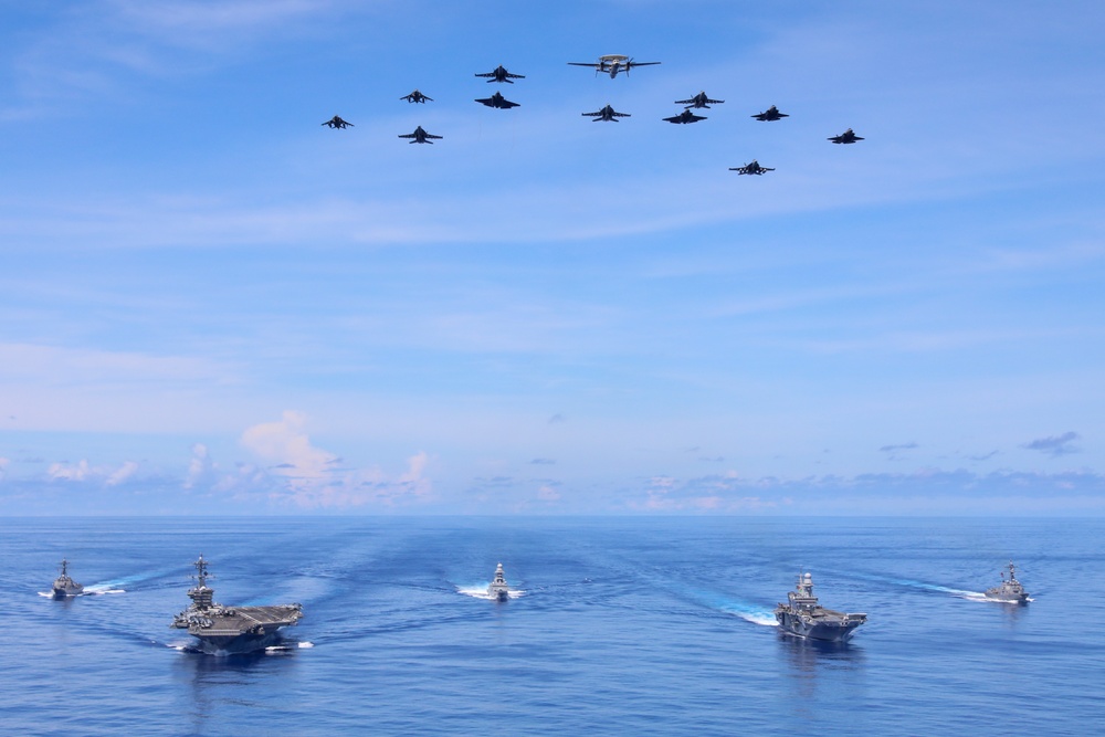 Abraham Lincoln Carrier Strike Group and Cavour Carrier Strike Group Sail in the Pacific Ocean