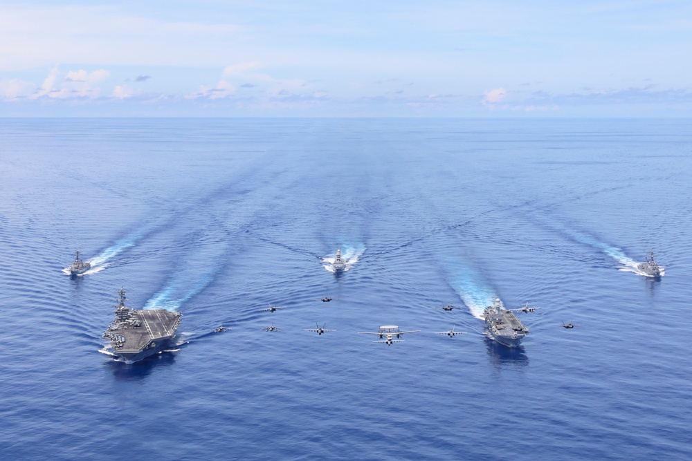 Abraham Lincoln Carrier Strike Group and Cavour Carrier Strike Group Sail in the Pacific Ocean