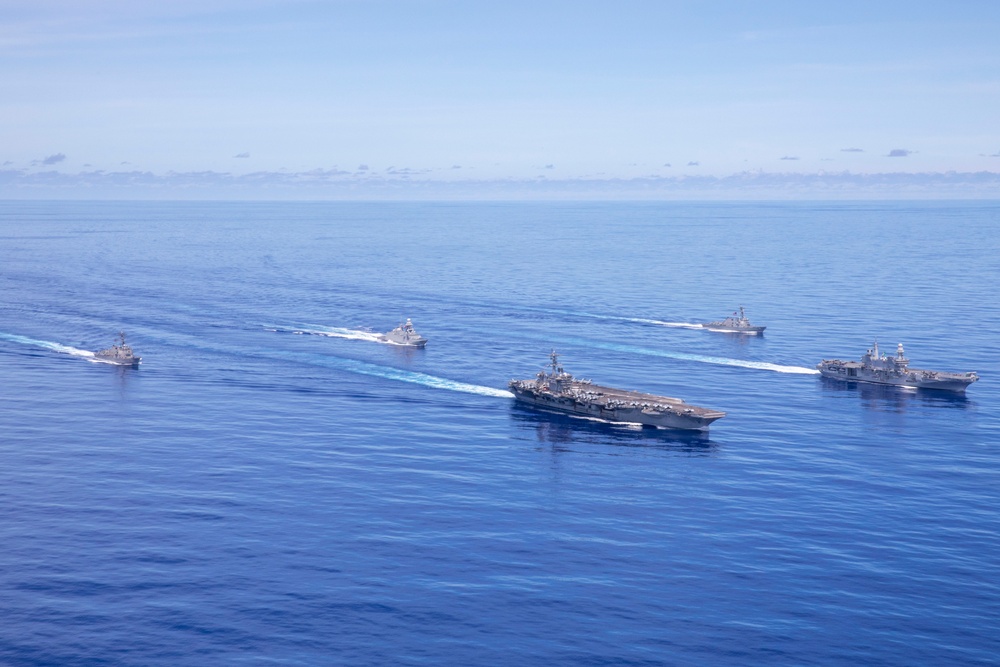 Abraham Lincoln Carrier Strike Group and Cavour Carrier Strike Group Sail in the Pacific Ocean