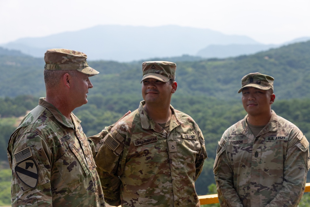 1st Armored Brigade Combat Team command team presents coins to service members during Operation Pacific Fortitude