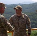 1st Armored Brigade Combat Team command team presents coins to service members during Operation Pacific Fortitude