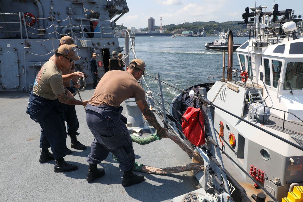 Sailors aboard the USS Howard conduct a sea and anchor detail in Yokosuka, Japan