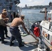 Sailors aboard the USS Howard conduct a sea and anchor detail in Yokosuka, Japan