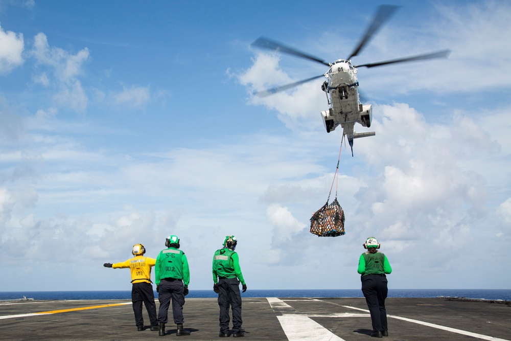 Abraham Lincoln receives cargo during a vertical replenishment