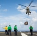 Abraham Lincoln receives cargo during a vertical replenishment