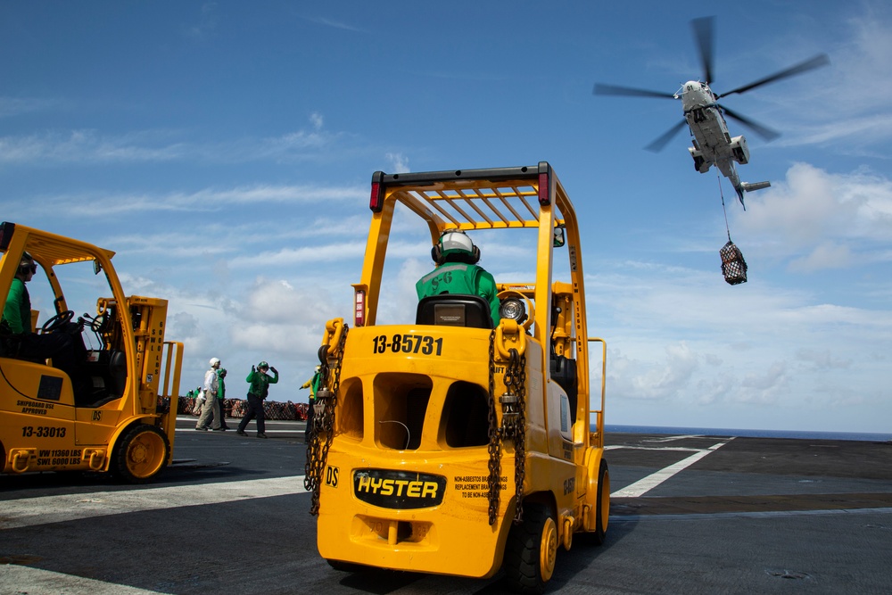 Abraham Lincoln receives cargo during a vertical replenishment