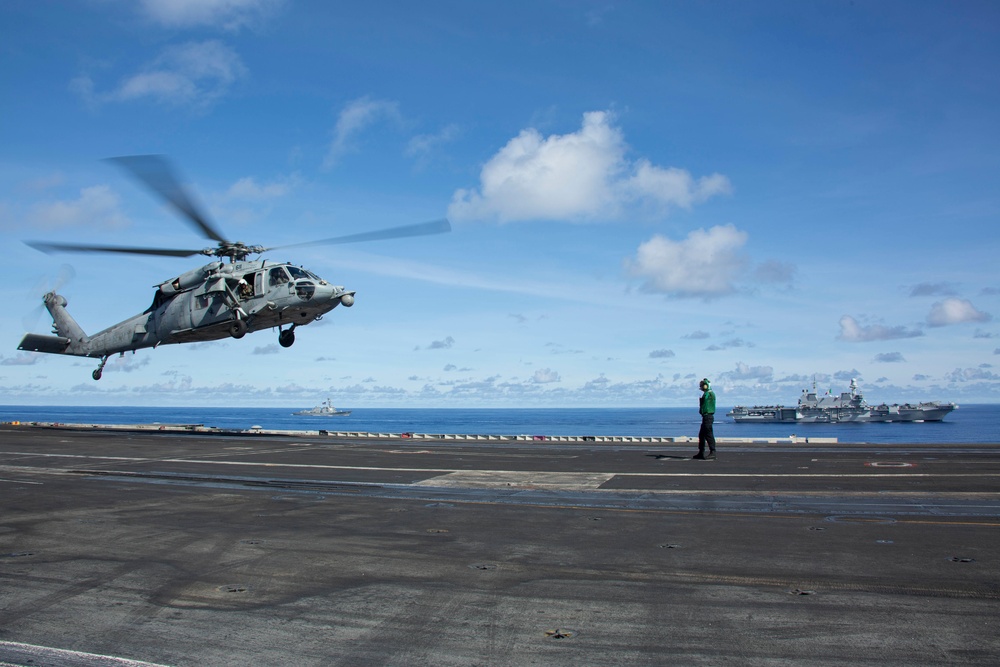 Abraham Lincoln Carrier Strike Group and Cavour Carrier Strike Group Sail in the Pacific Ocean